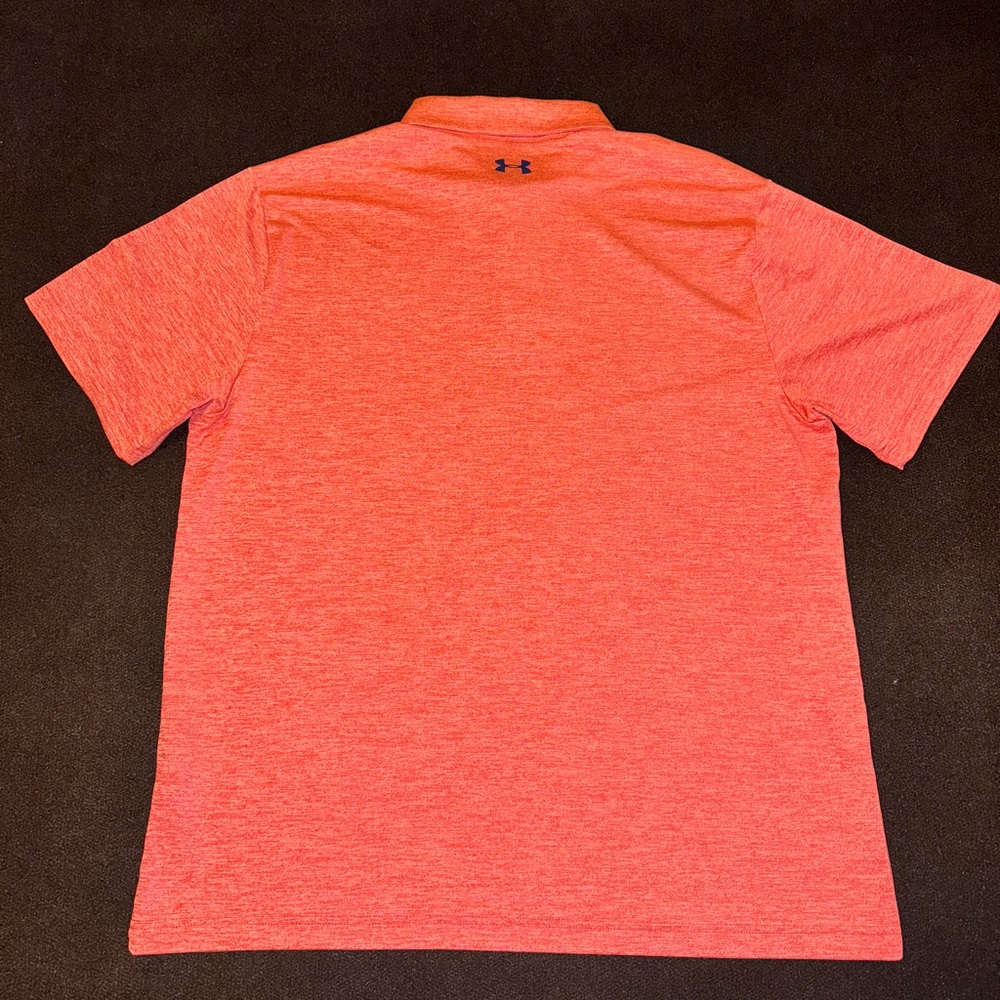 Under Armour Golf Polo, in a fluorescent peach color-way.  Sz Large.